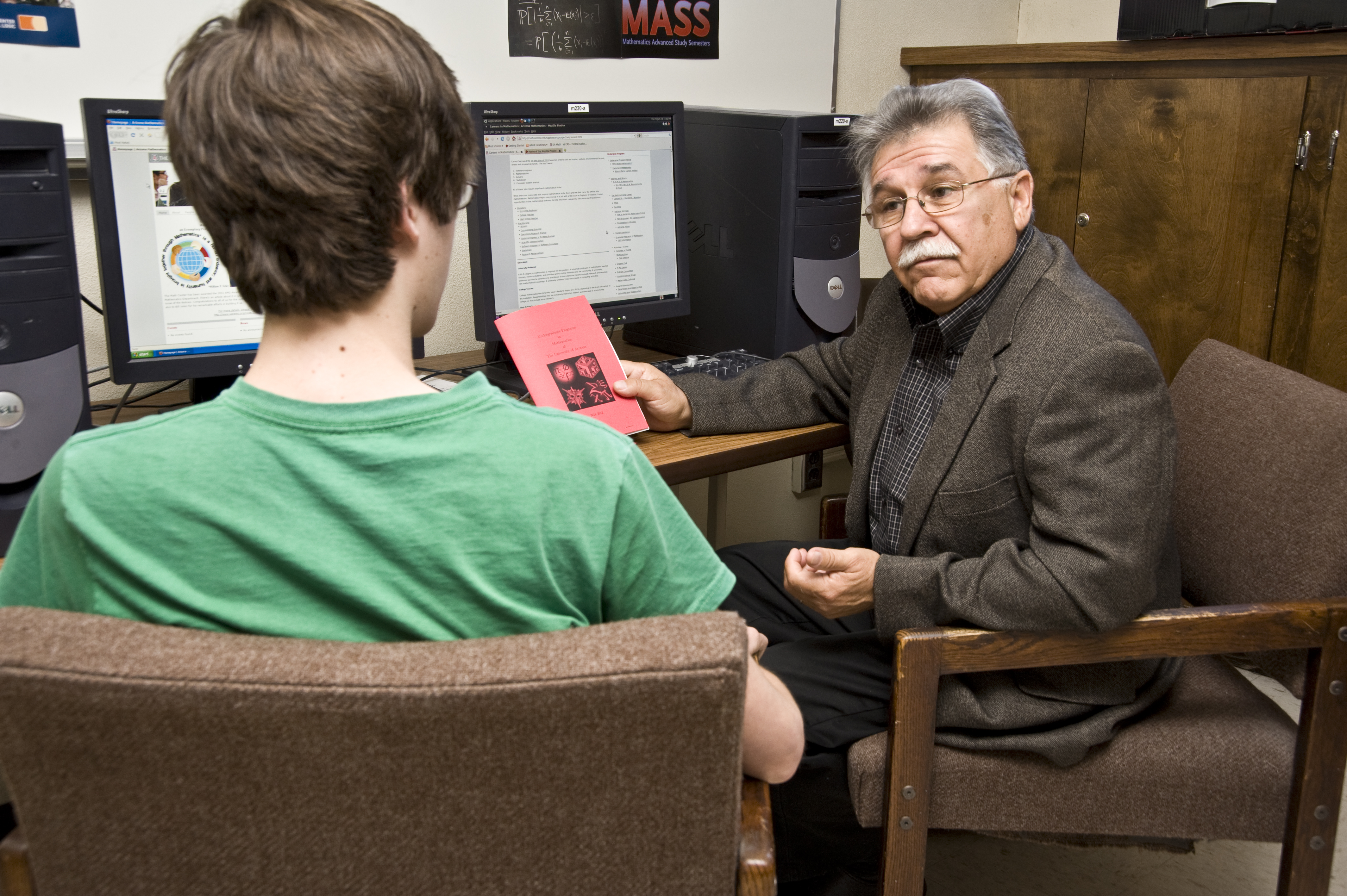 Dr. Velez, Associate Head for Undergraduate Affairs, advising a math major.
